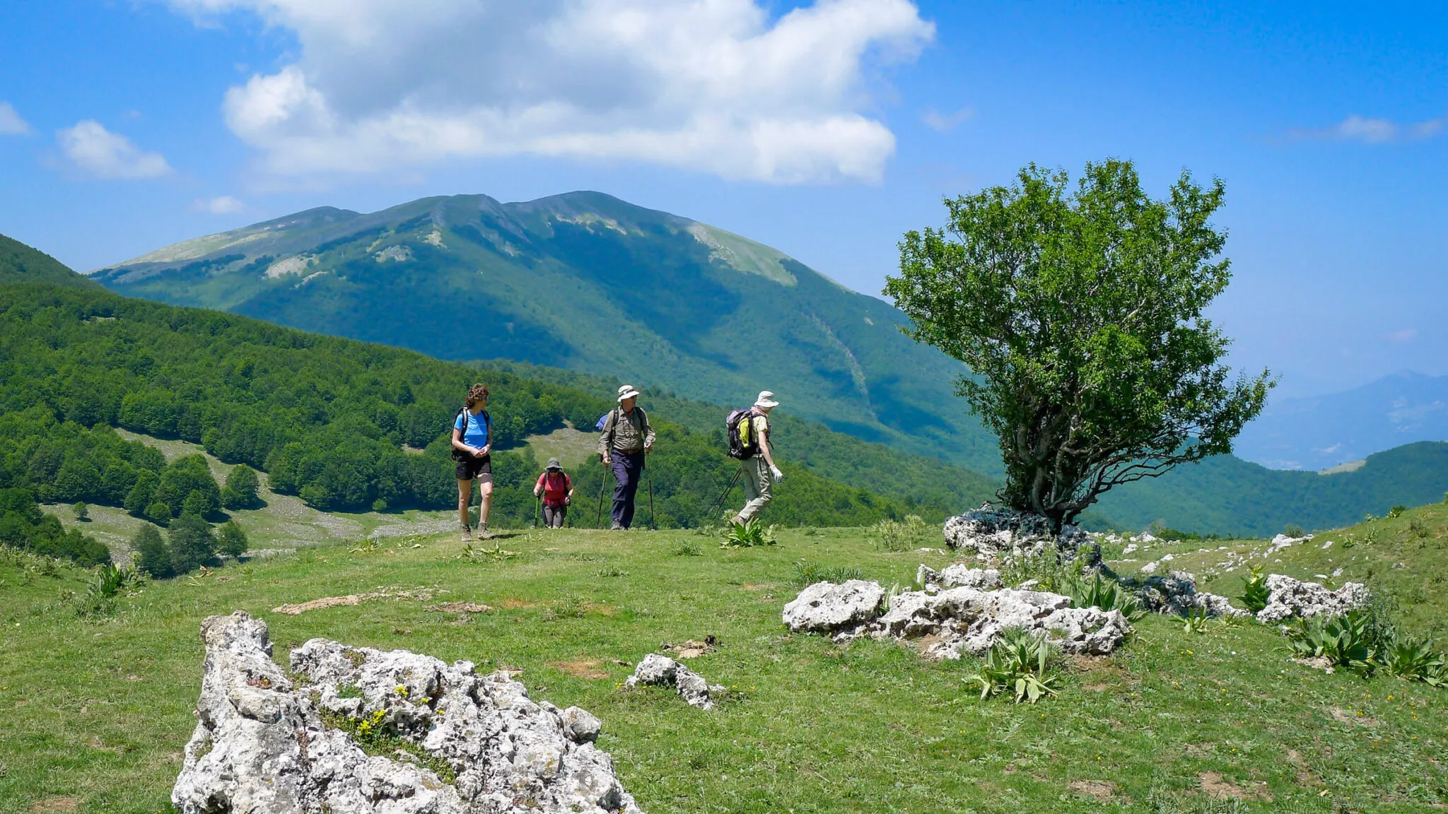 A group hikes in the Italian countryside