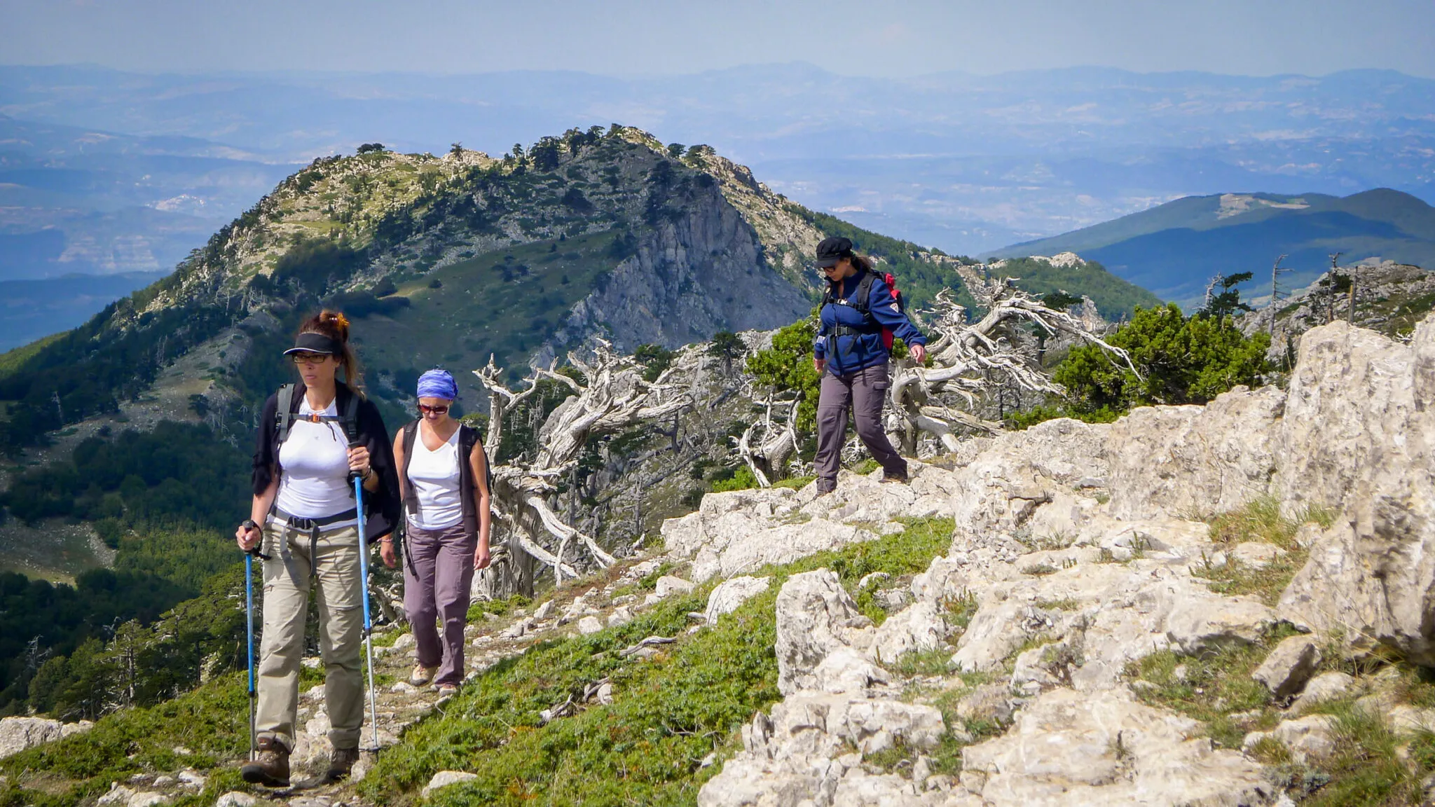 Three women hiking in the Italian countryside