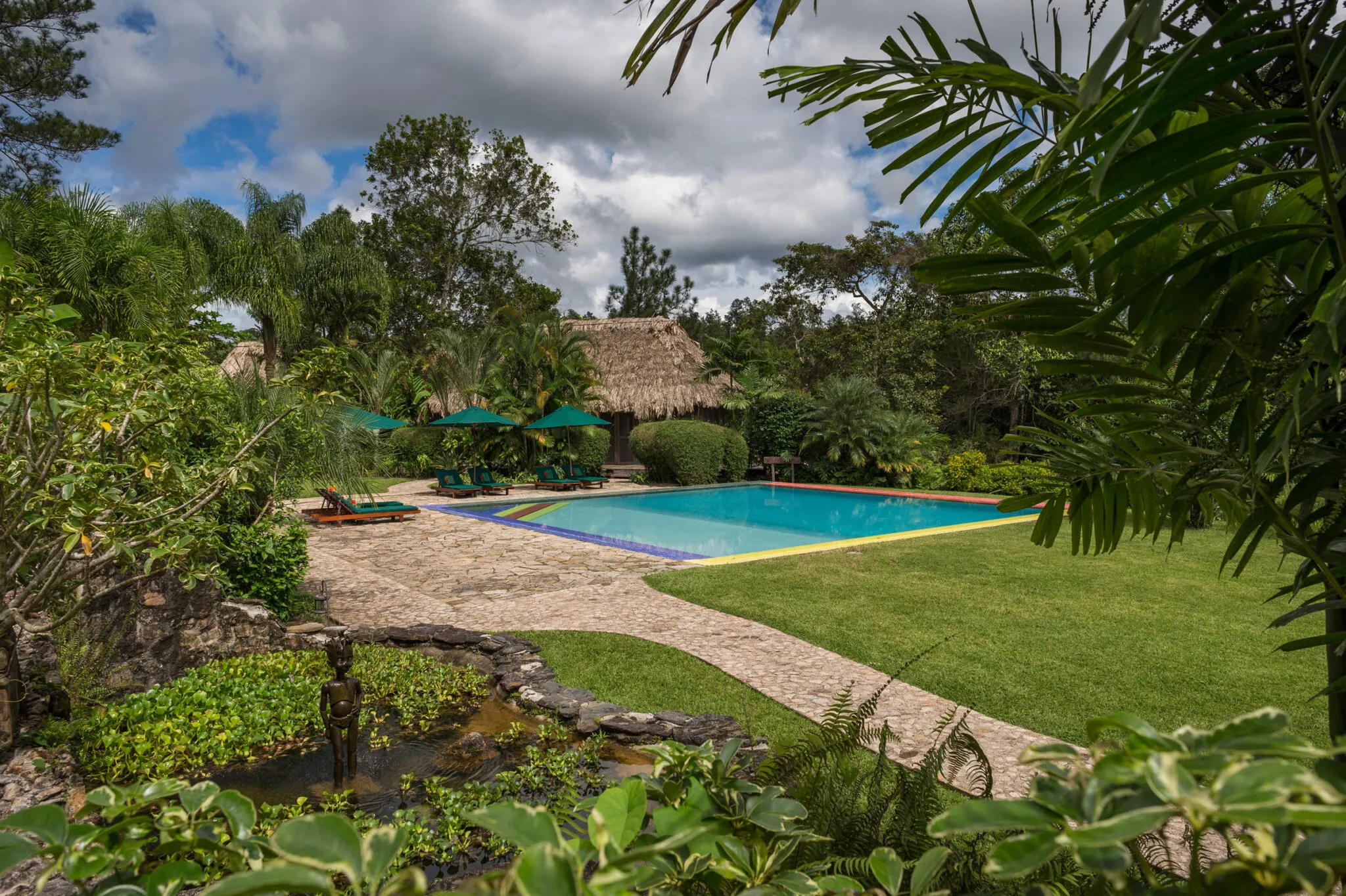 Walkway leading to the outdoor pool in the background