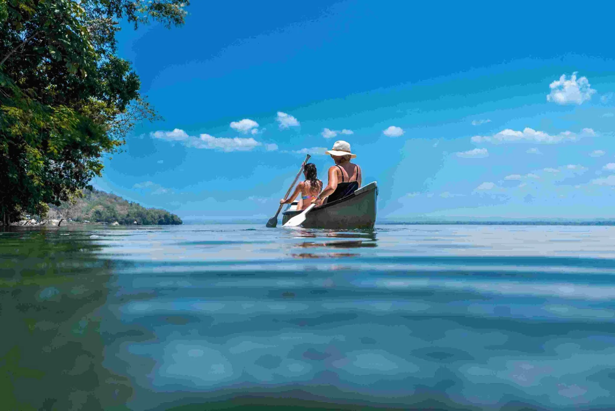 Two patrons enjoying a canoe in the water surrounding La Lancha.