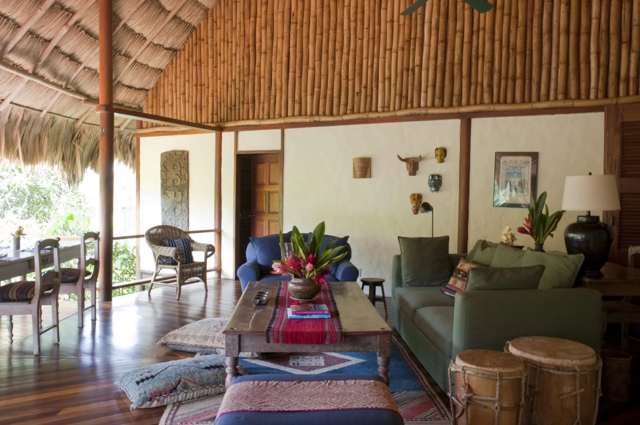 Living area with sofa, armchairs and dining area