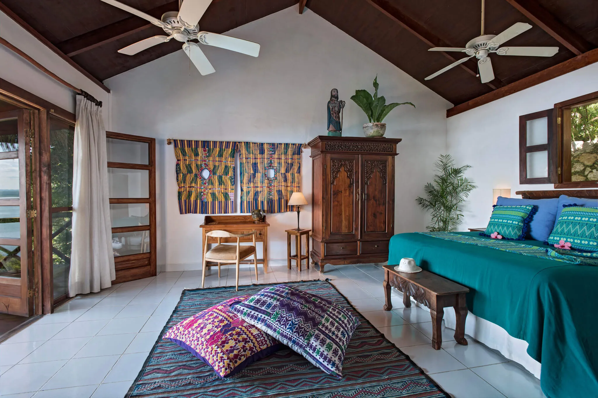 A view of the bright, white living area in a Lakeview Suite at La Lancha.