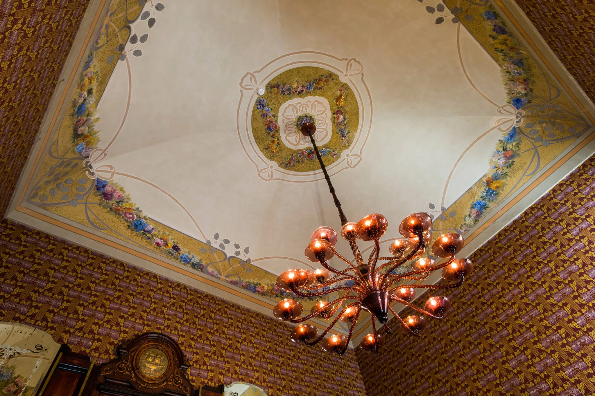 Painted ceiling with brass hanging light