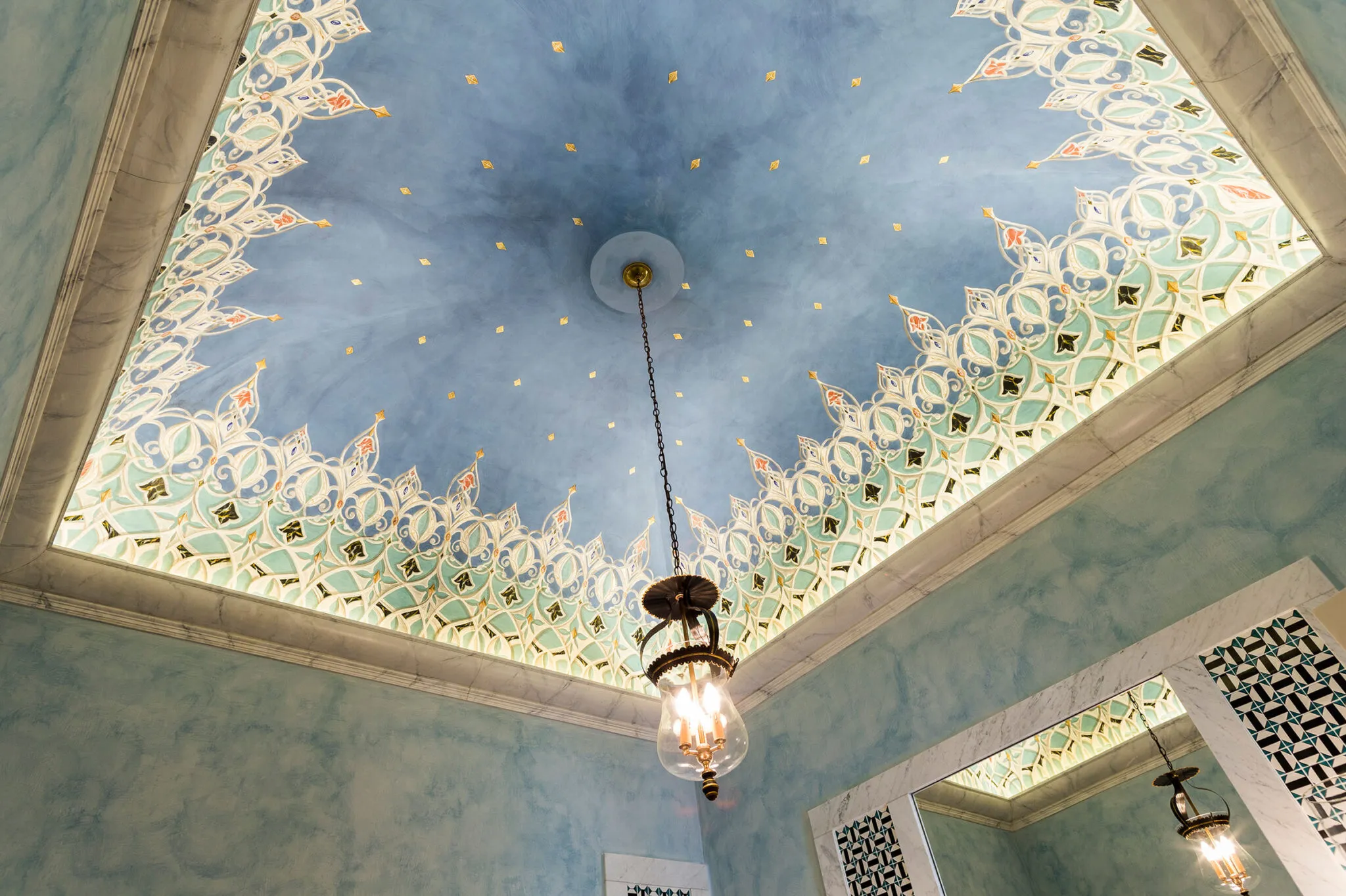 Blue bathroom ceiling with intricate molding