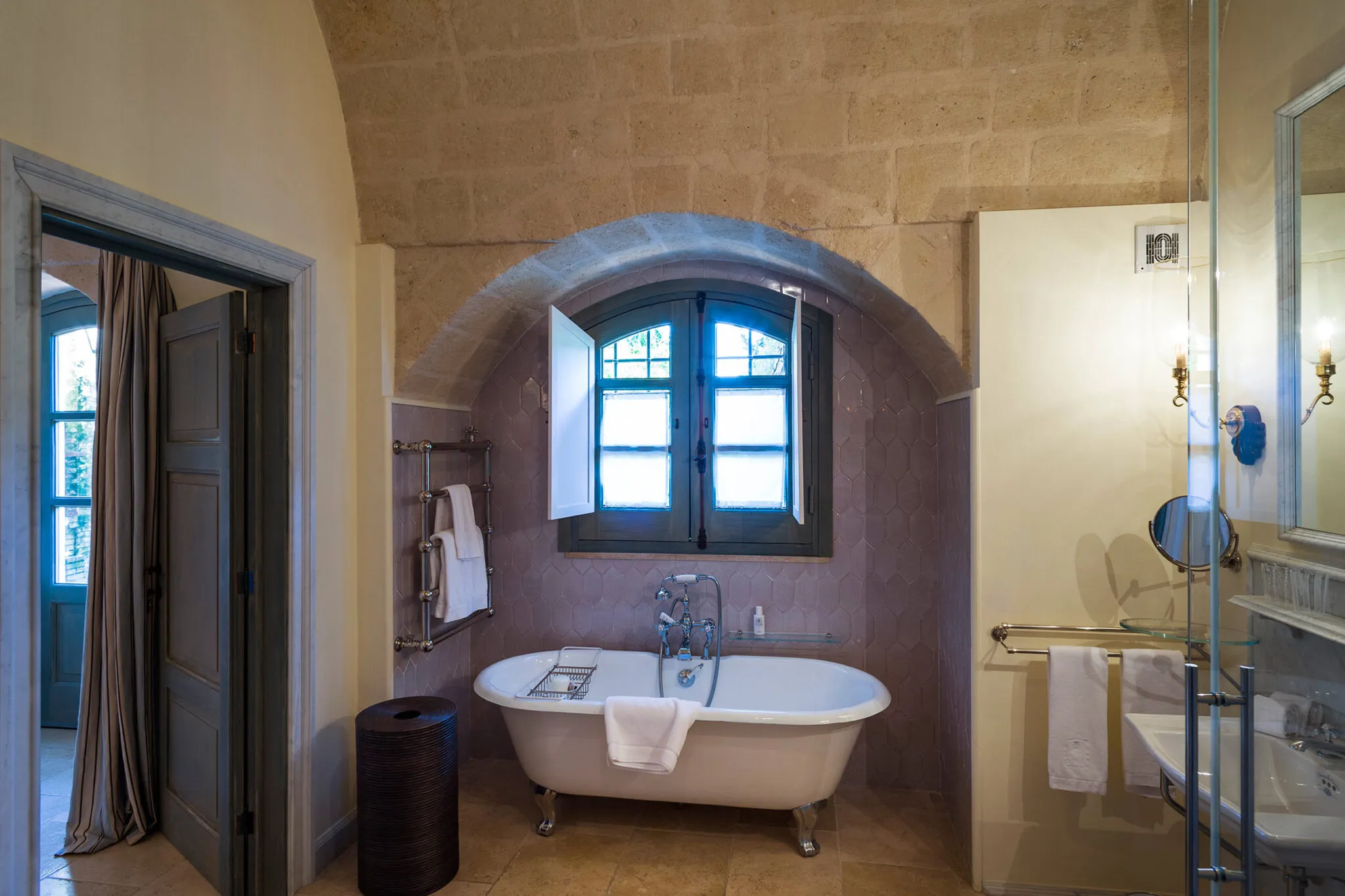 A clawfoot tub in the en suite bathroom