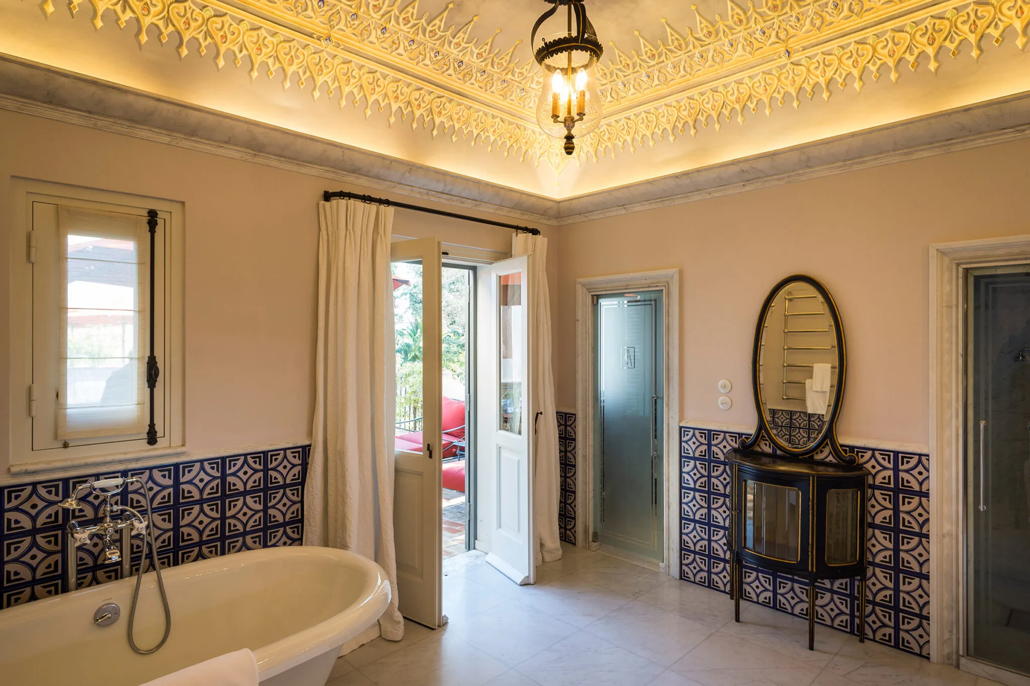 Bathroom with door leading onto the patio