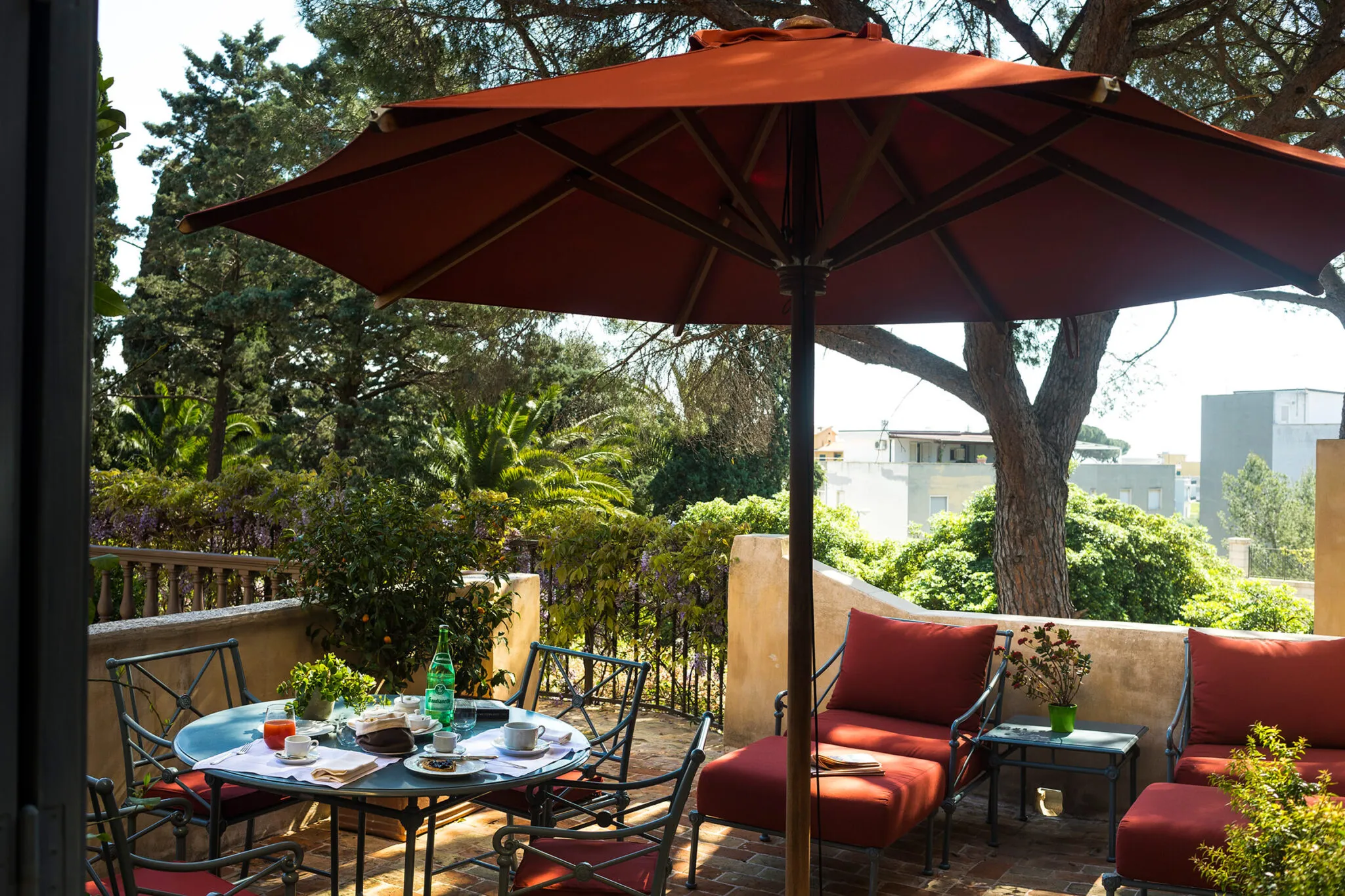 Outdoor dining area with table and umbrella