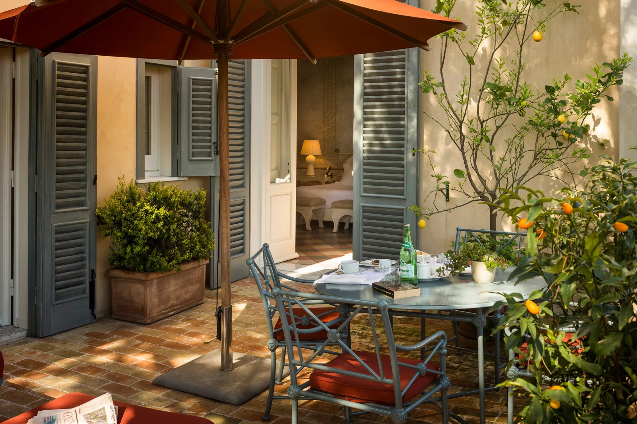 Outdoor dining area on a patio outside of suite four