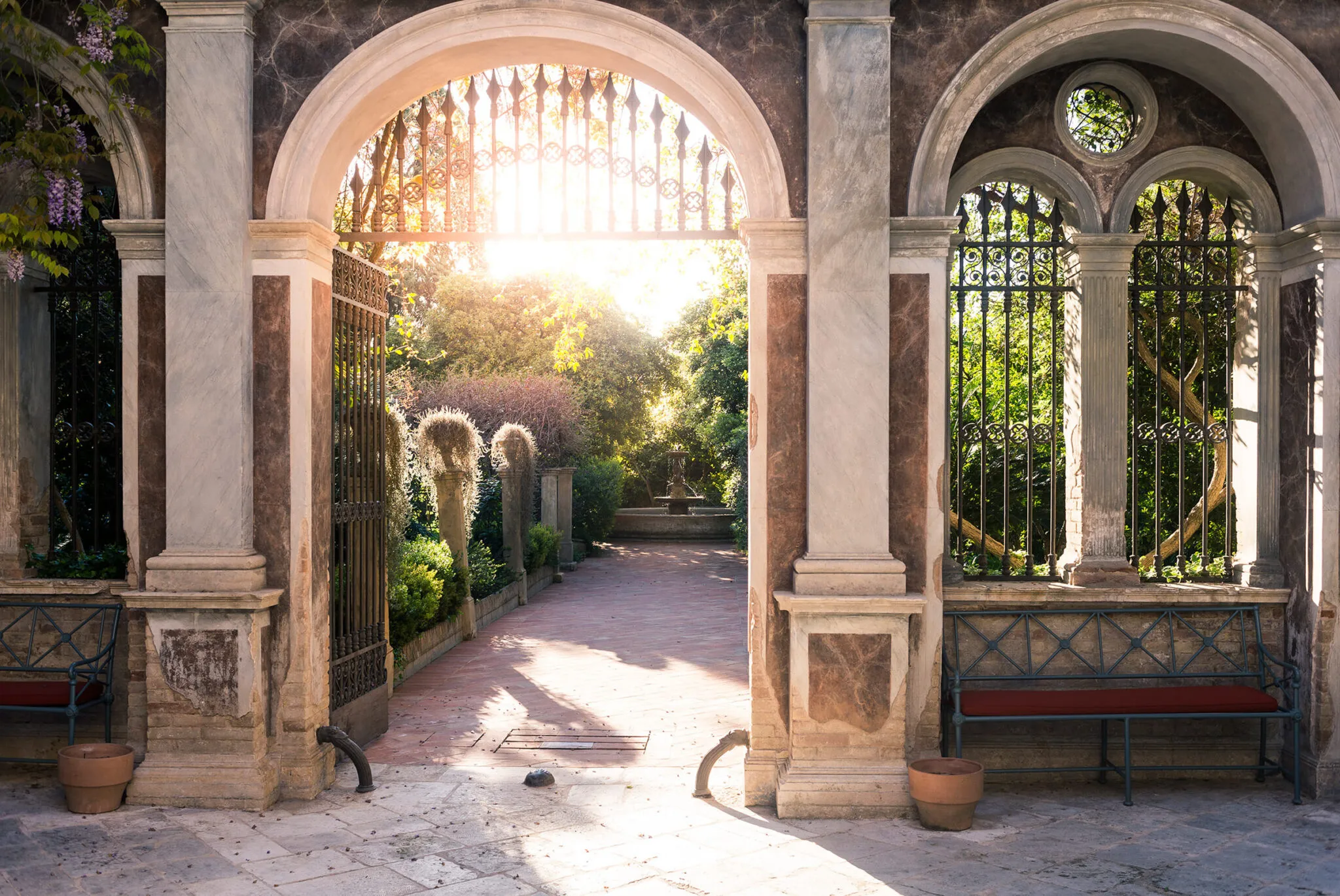 Sun shining through arched gateways