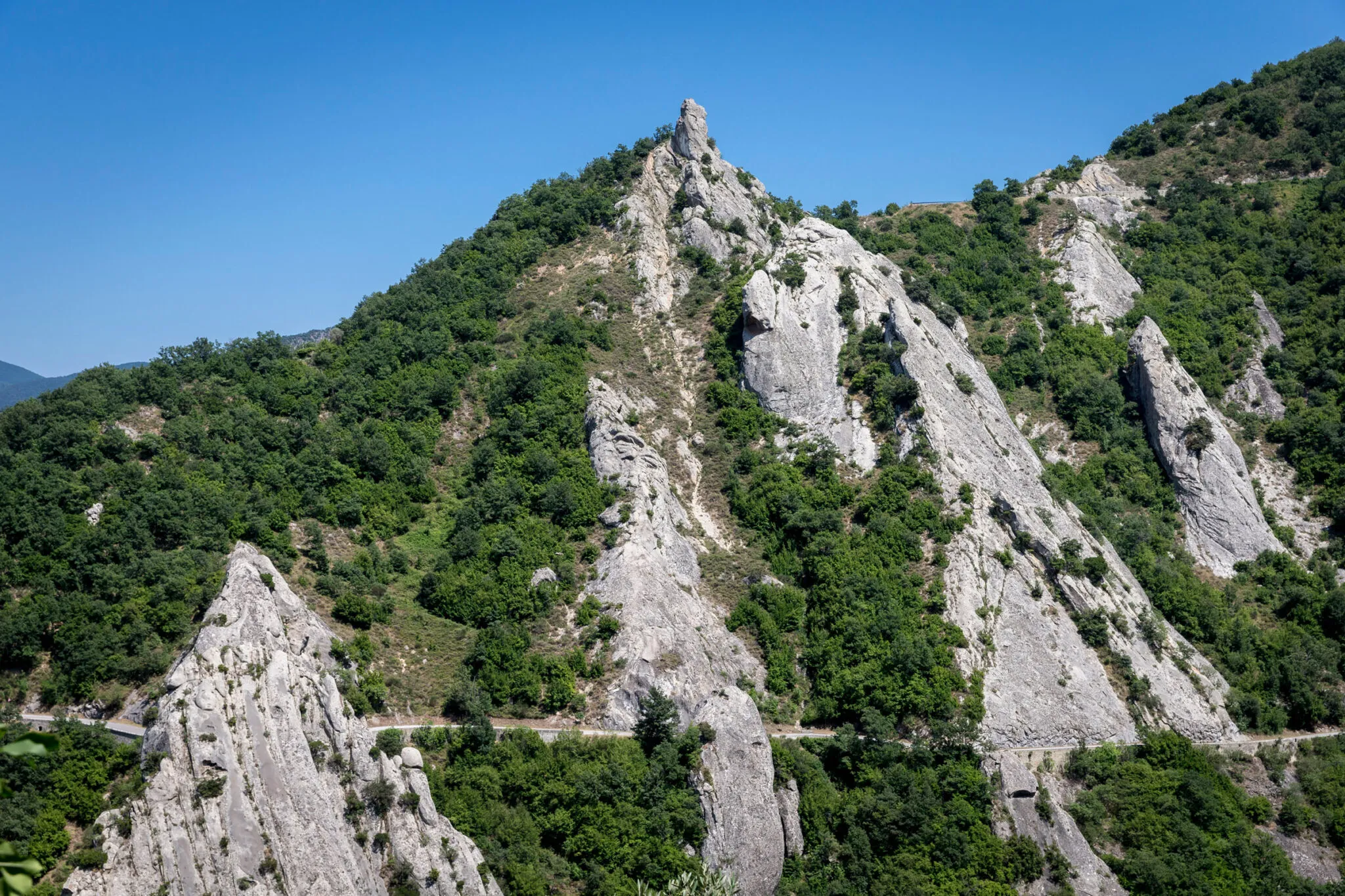 Rocky mountainside with a road cut into it