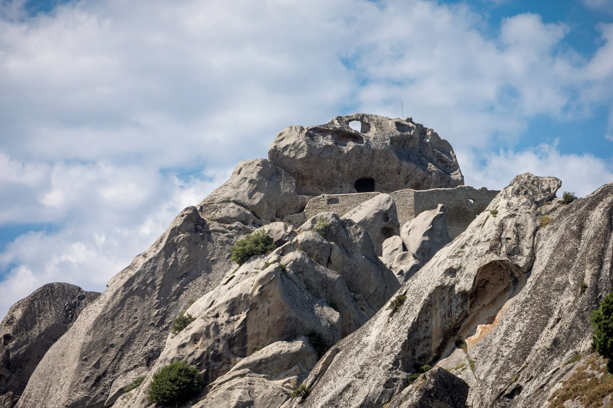 ancient building carved into the hillside