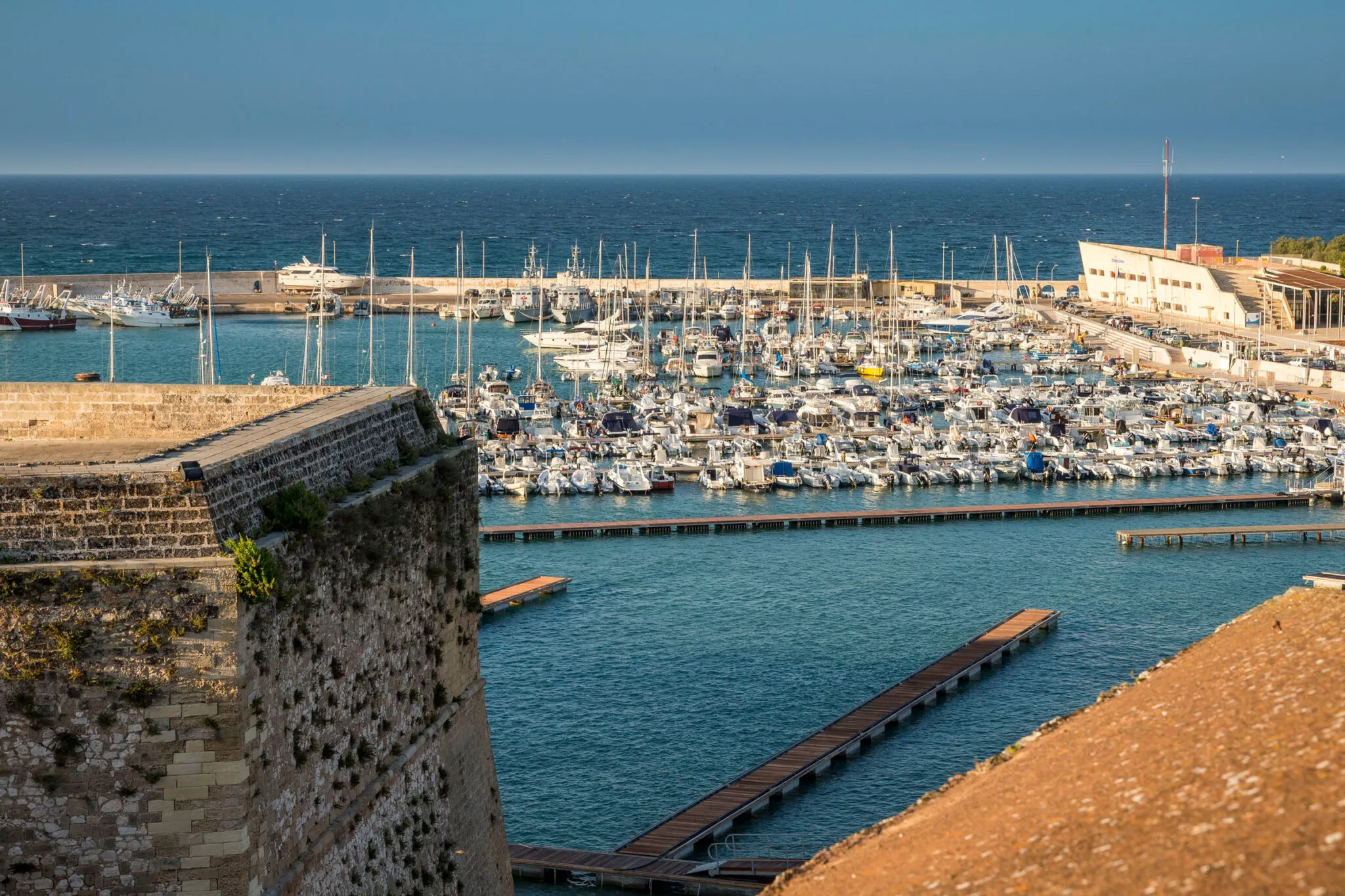 Boats docked at the harbor in Otranto