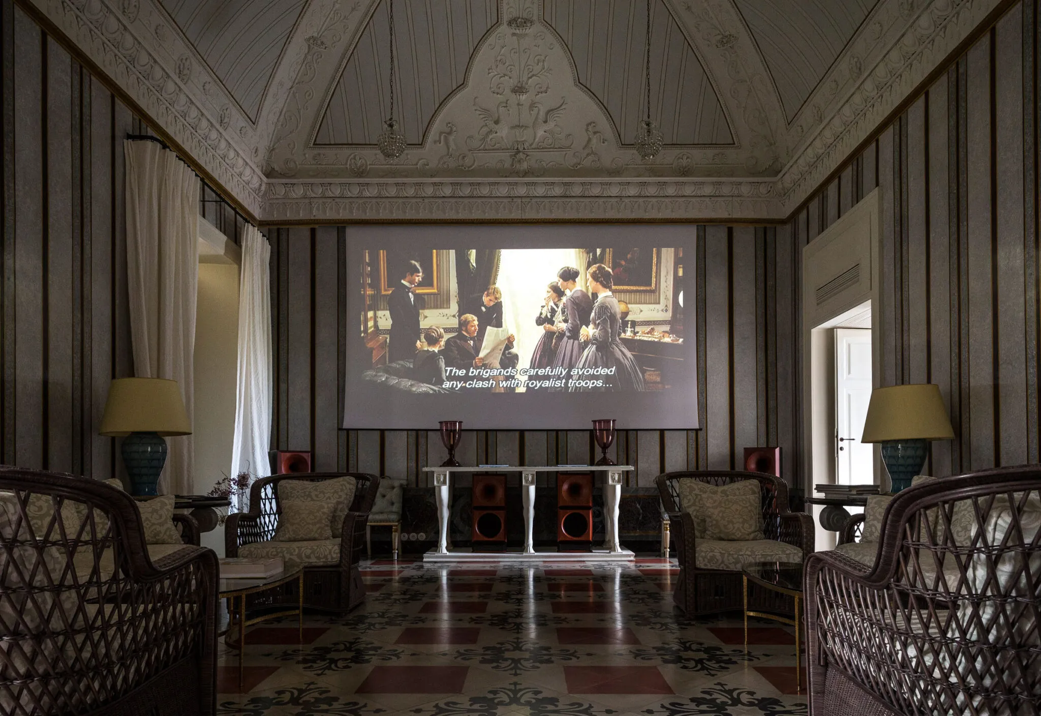 A film plays in the Salon Cinema