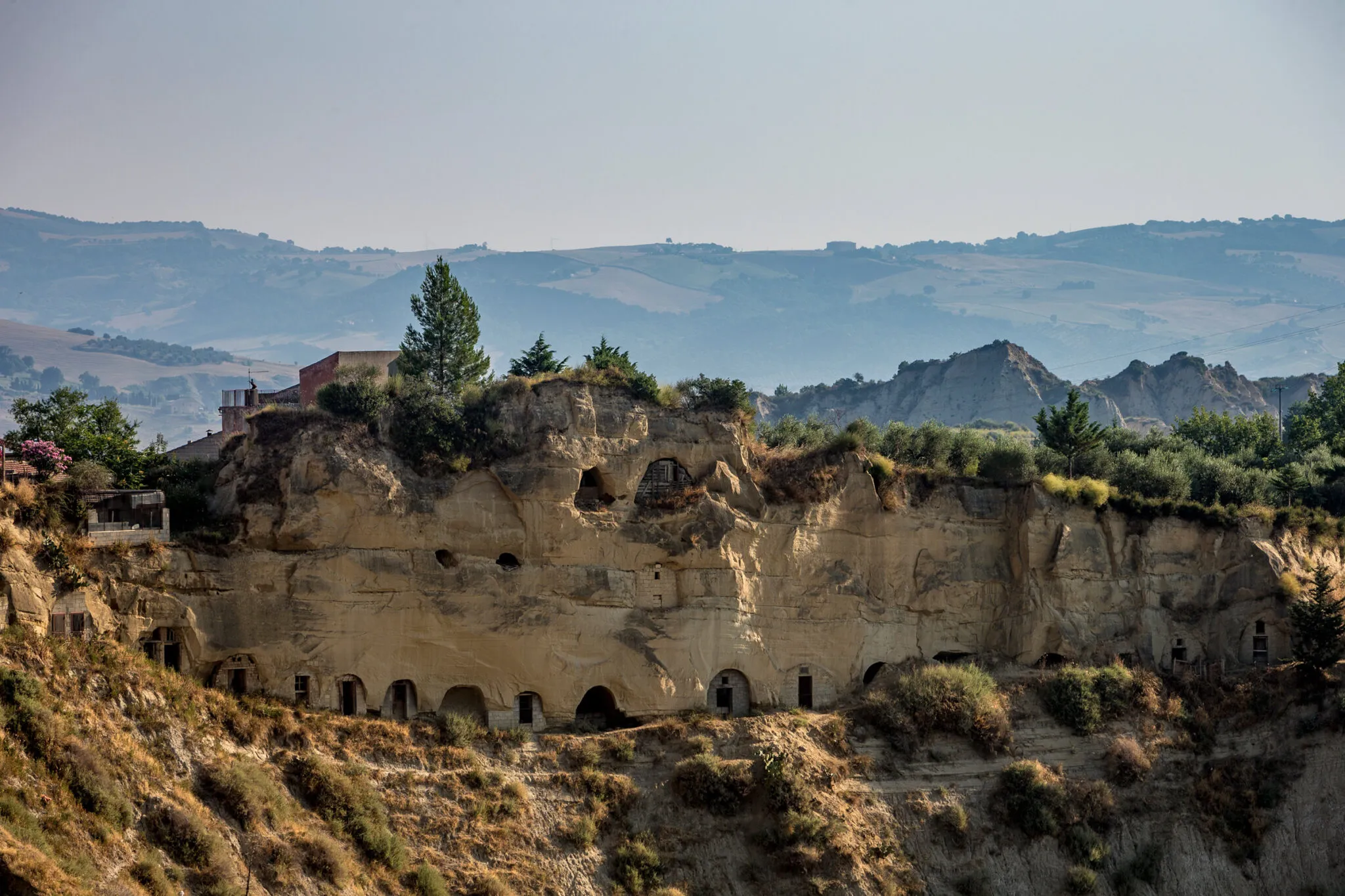 buildings carved into a hillside