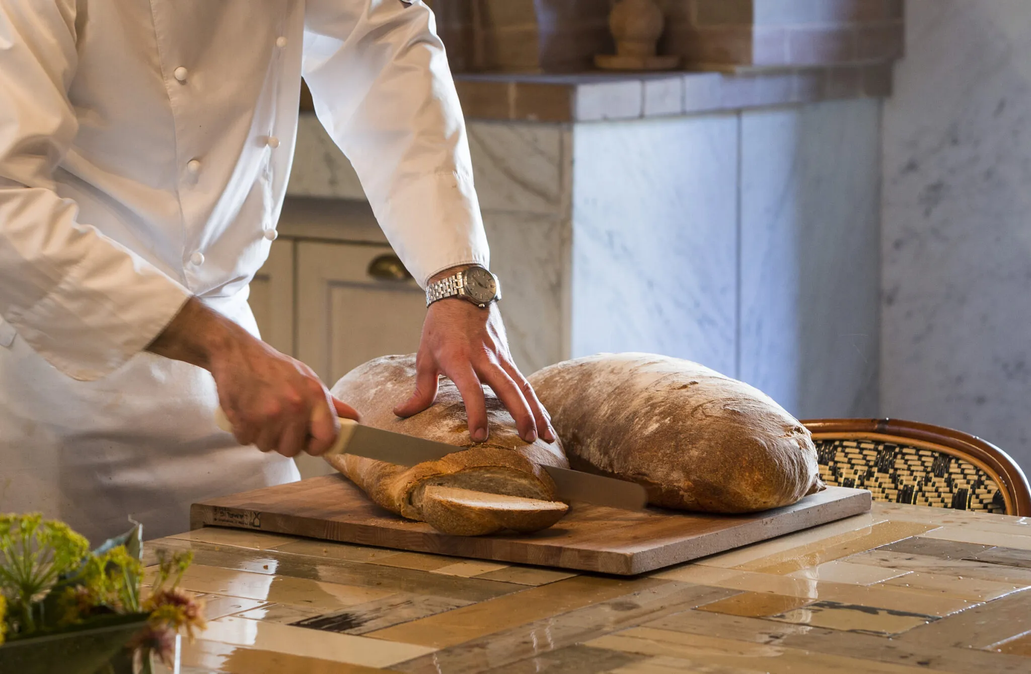 Palazzo Margherita Chef making slicing bread