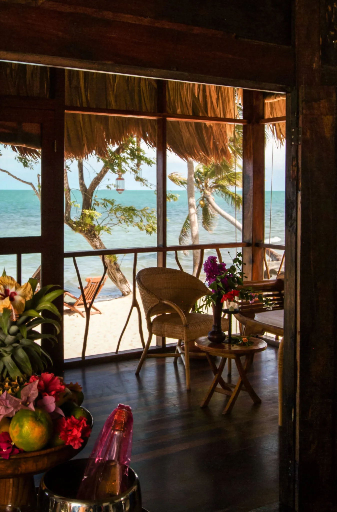 A wicker chair on a patio with ocean views