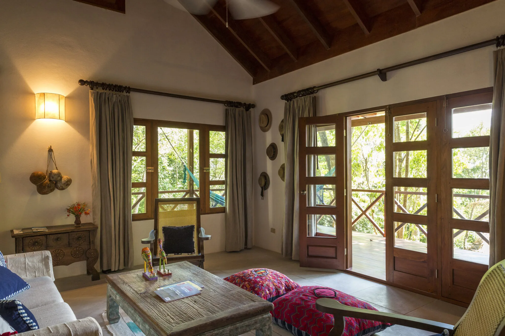 An overview of the Rainforest Junior Suite's interior, from the living space to the outdoor deck..