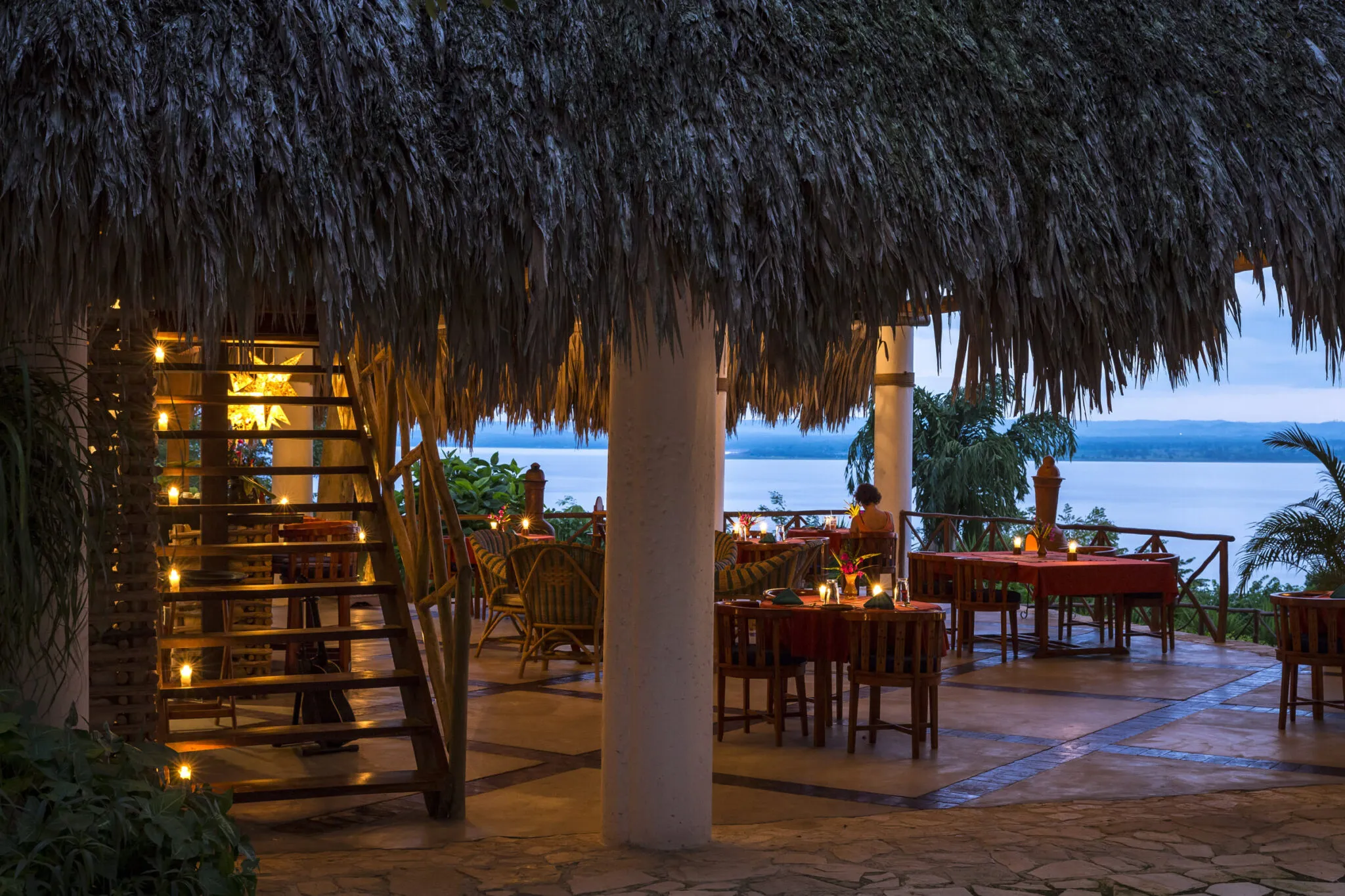 The candlelit restaurant at La Lancha at dusk.