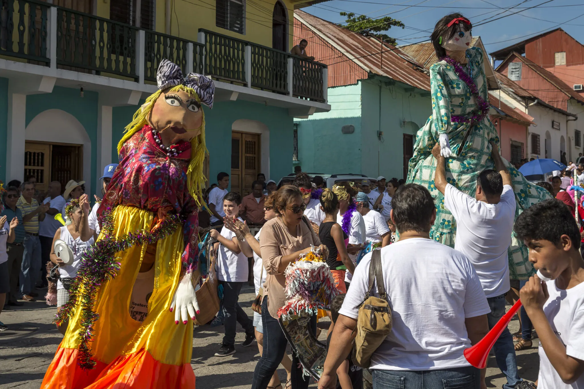 People interacting in a street festival at the Lake Petén Itzá and Flores tour.