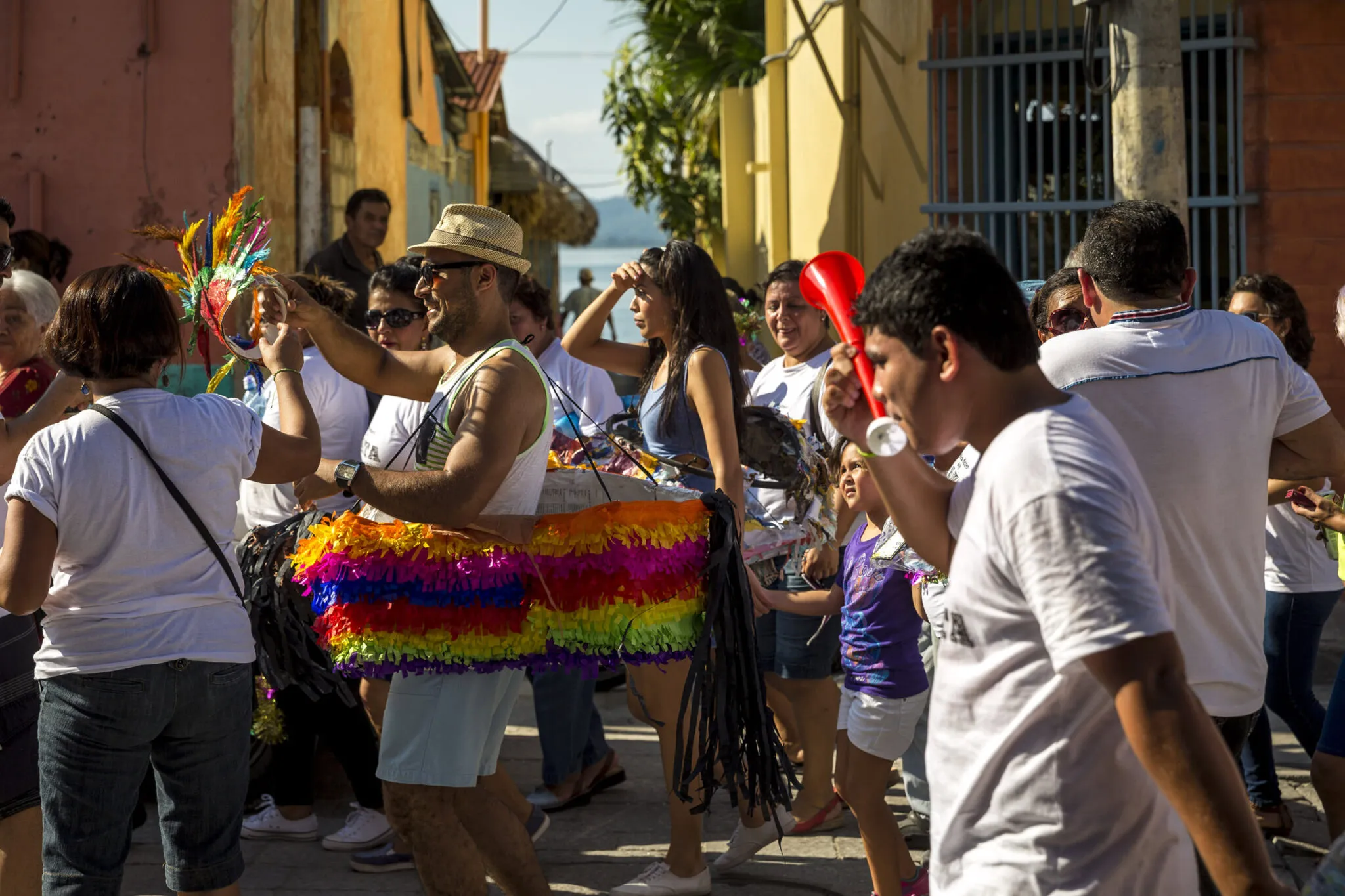 People interacting in a street festival at the Lake Petén Itzá and Flores tour.