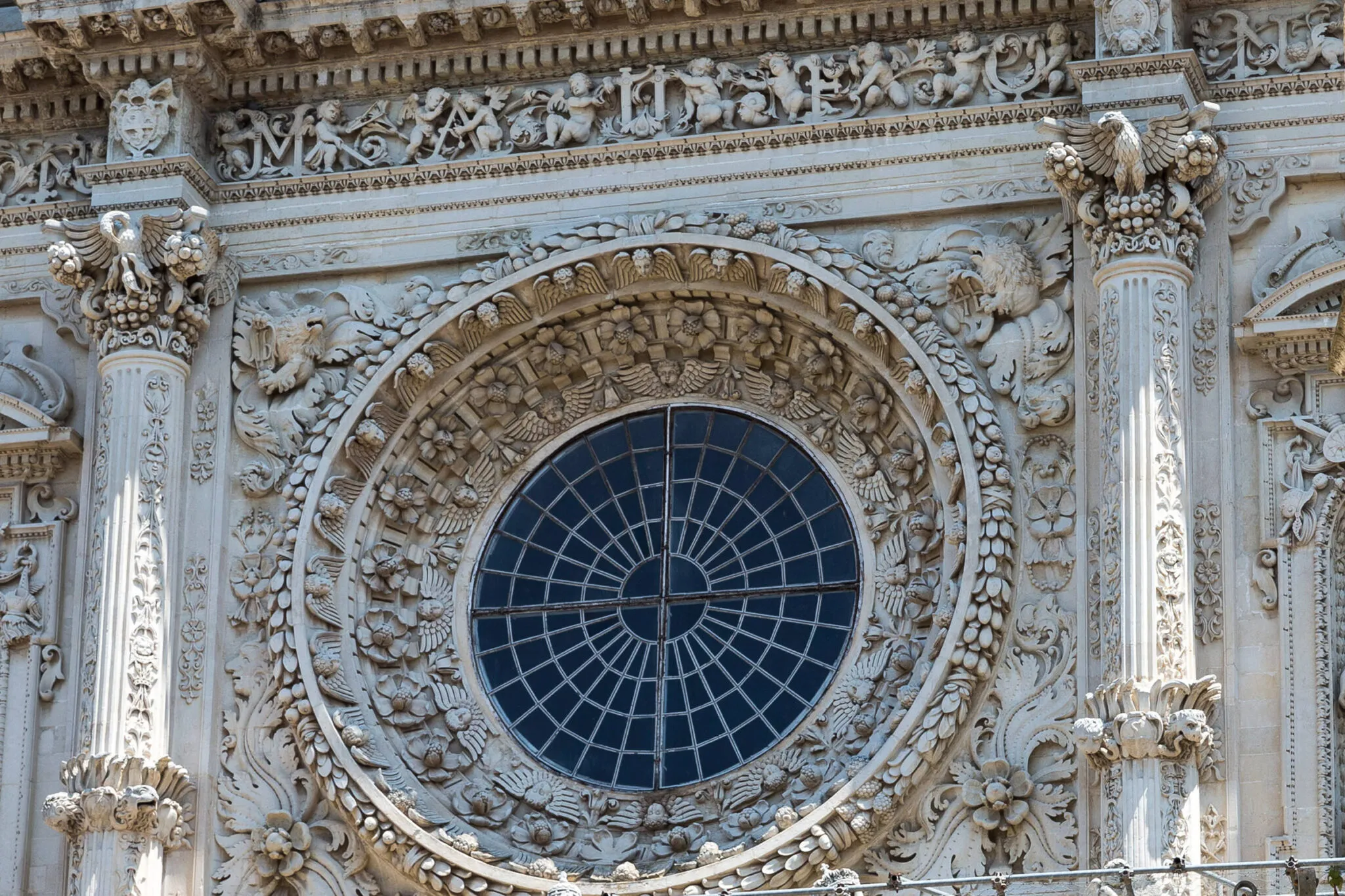 Stone carvings around a large circular window