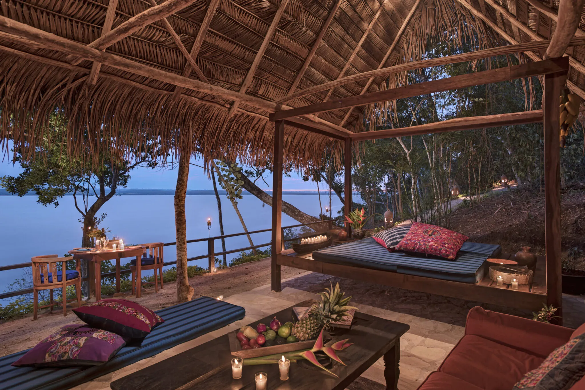 A view of an outdoor lounge area at La Lancha at twilight.