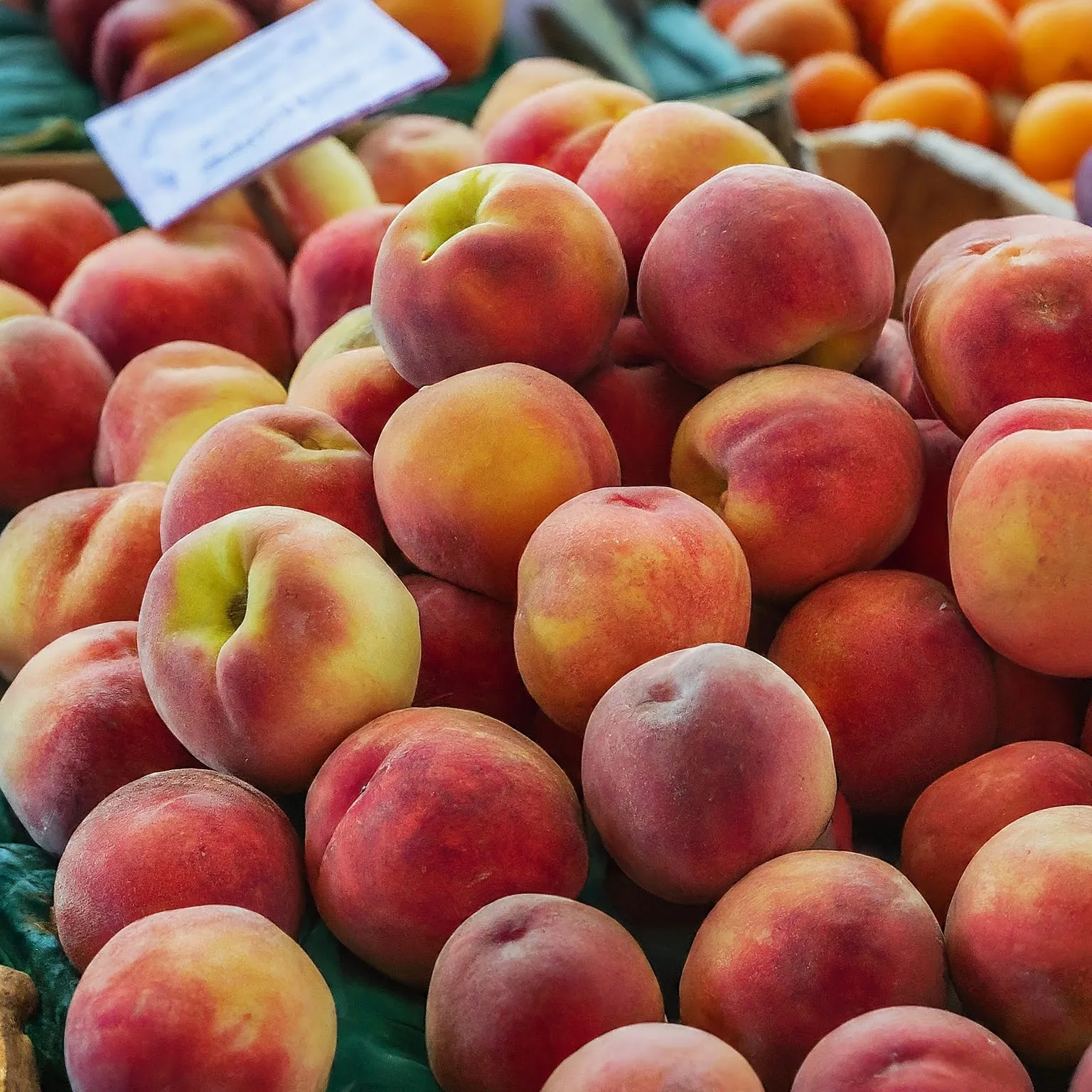 A basket of ripe Georgia peaches for sale.